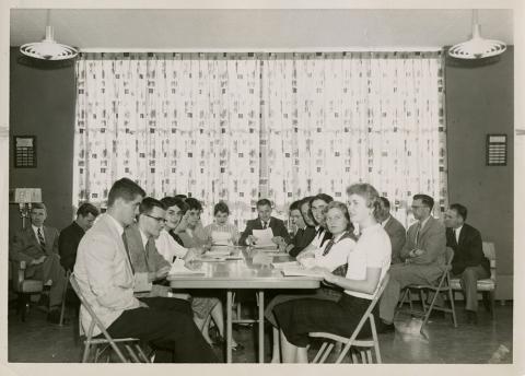 Plymouth State in 150 Objects 1950s Student Council meeting at a dining table