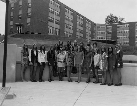 Plymouth State in 150 exhibition students posing outside the Pemigewasset building