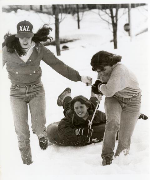 Plymouth State in 150 exhibition 1970s students sledding