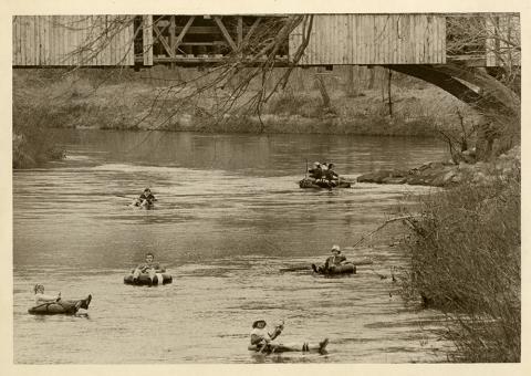Plymouth State in 150 exhibition 1970s students tubing down a river