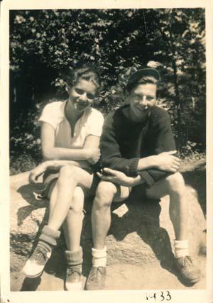 Two women sitting outside at camp Lee