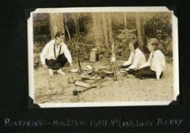 Campers at a campfire at Camp Grey Rocks