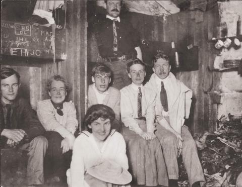 Party in Madison Hut Photographer, Ralph C. Larrabee standing at rear.