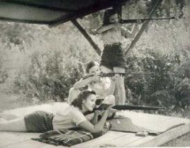 White mountain campers aiming rifles