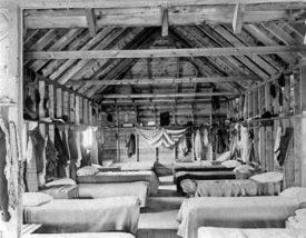 Historical image of inside a lodge at Camp Pasquaney.
