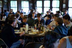 Campers inside a dining hall at Camp Pasquaney.