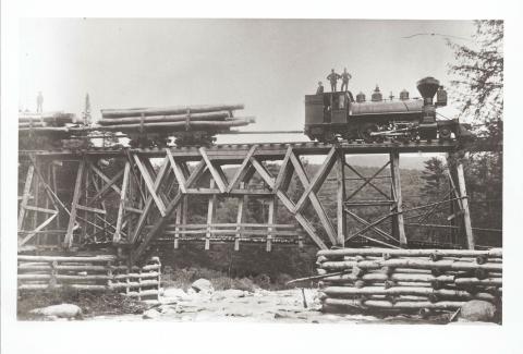 Logging train on a trestle after the civil war