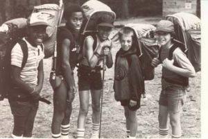 Young hikers with backpacks at Camp Hale