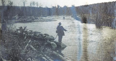 Man fishing on a lake or river
