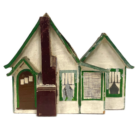 Photograph of incense burner in shape of cabin.