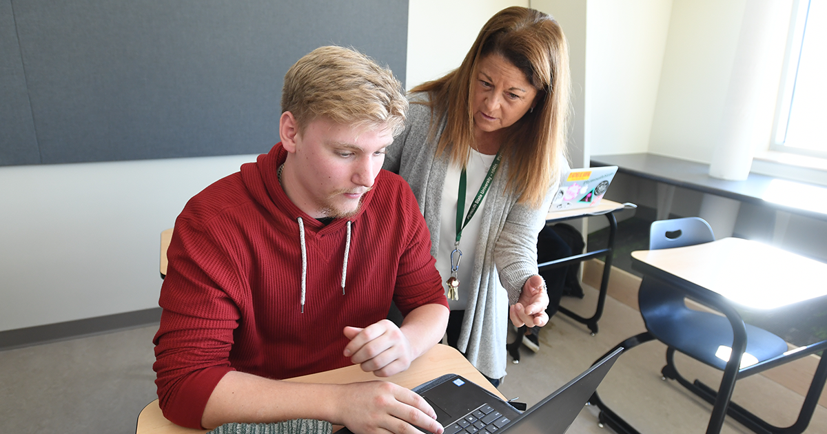 Student and professor in classroom