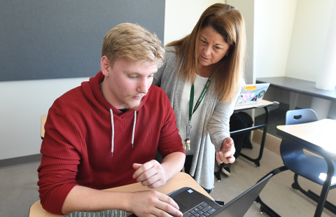 Student and professor in classroom