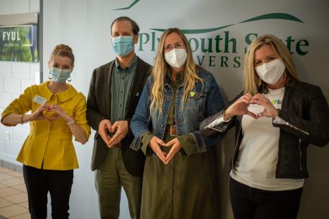 People with heart hands