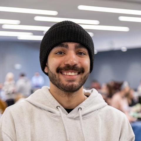 Student poses for a headshot