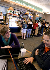 Two students enjoy a laugh during lunch in the Commons Cafe.